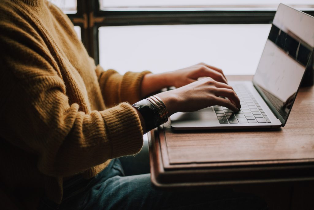 woman looking up local businesses on laptop